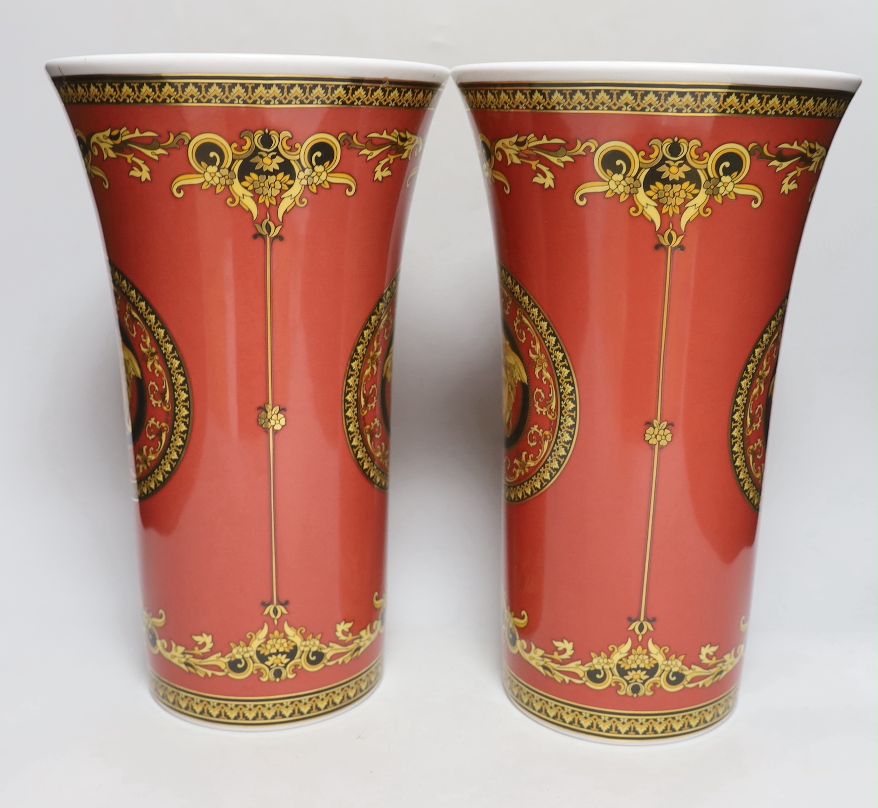 A large pair of Rosenthal Versace Medusa pattern vases, 34cm tall